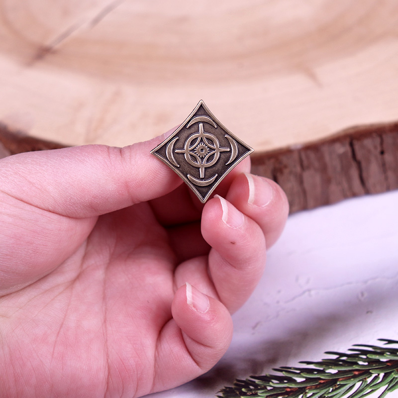 Cosmere symbool badge stormlic - Vintage Fashion Archive recensie en prijs