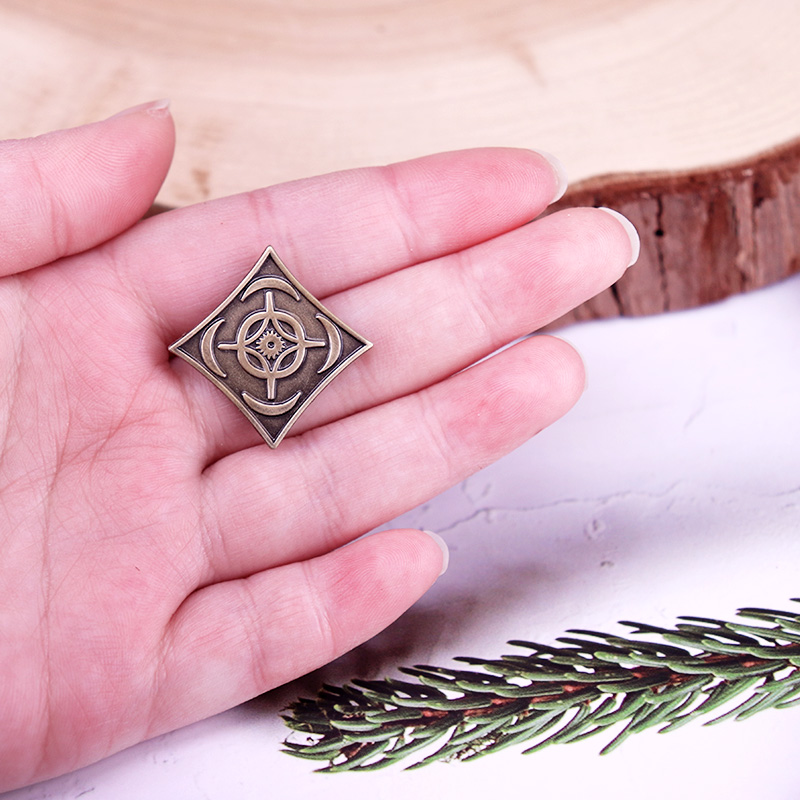 Cosmere symbool badge stormlic - Vintage Fashion Archive recensie en prijs